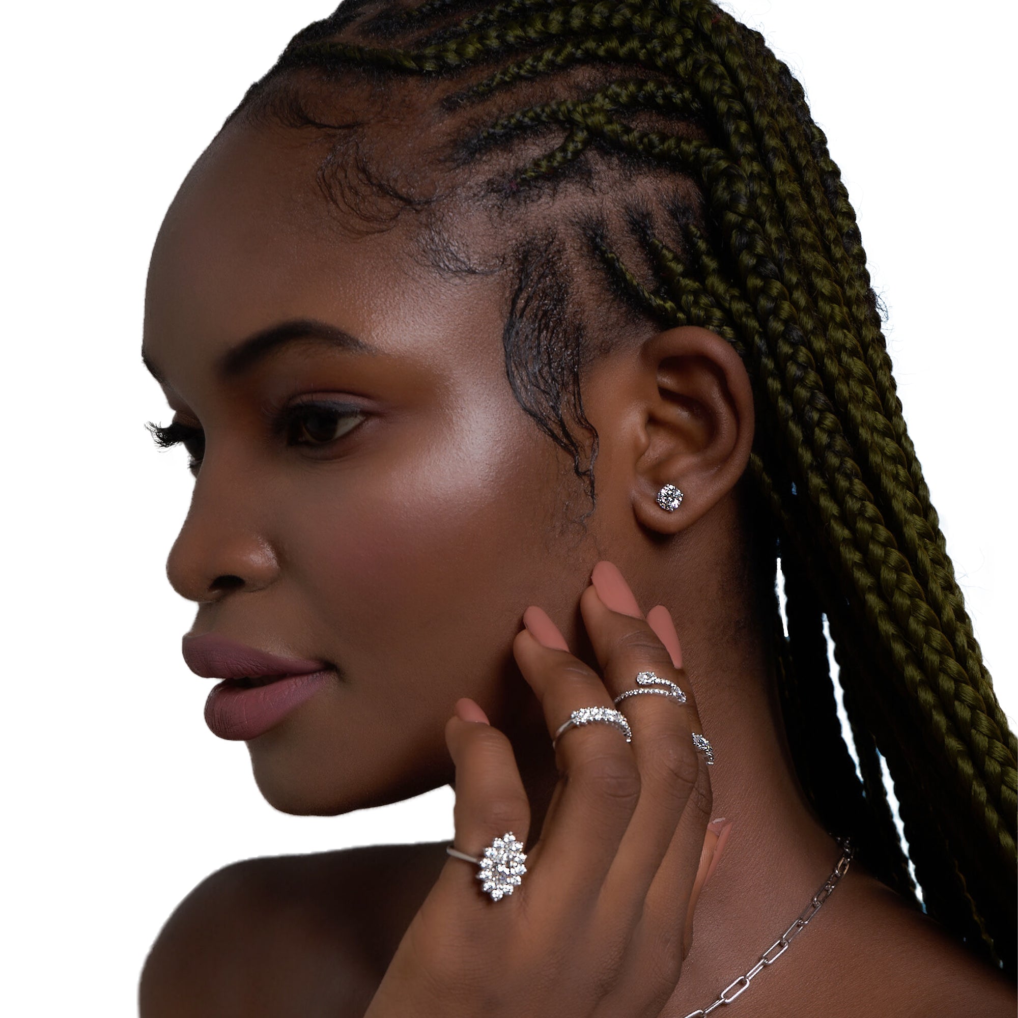 Close up of woman wearing 1 ct diamond stud earrings from Carat Diamond, highlighting their exceptional sparkle and elegance.