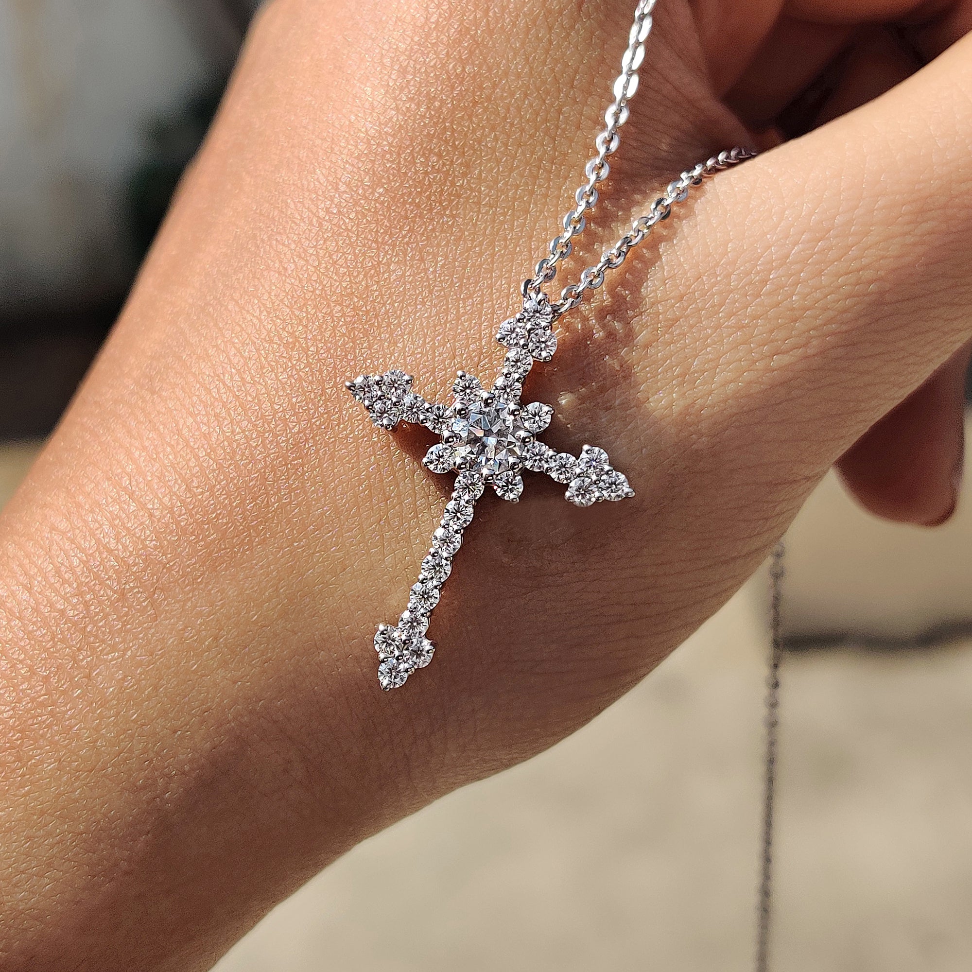 Round cut moissanite pendant crafted as a Cross pendant for everyday or occasion wear.
